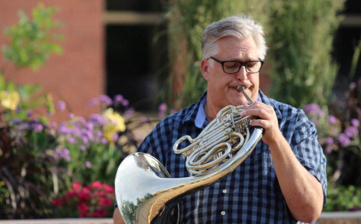 Rob Schmidtke plays French horn